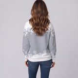 Playful Women's Christmas Jumper Featuring a Festive Snowman Print