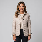 Women's quilted jacket with a collar and long sleeves by Ivy & Co, image 1 of 4